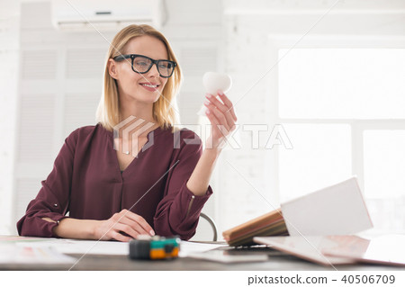 Vigorous female designer receiving sample 40506709