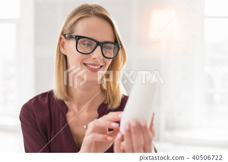 Happy female designer studying sample 40506722