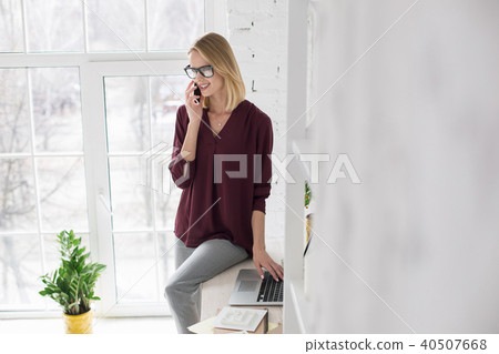 Charming happy businesswoman making appointment Charming happy businesswoman making appointment 40507668
