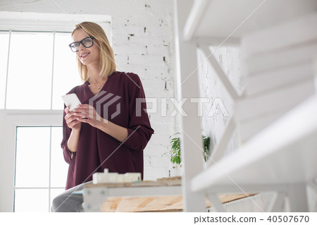 Nice enthusiastic woman typing messages Nice enthusiastic woman typing messages 40507670