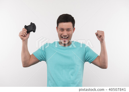 Delighted emotional man cheering with his hands 40507841