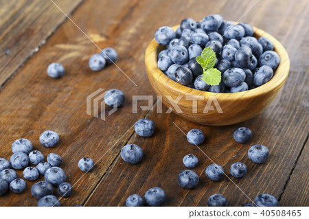 ripe organic bog whortleberry in a wooden plate ripe organic bog whortleberry in a wooden plate 40508465