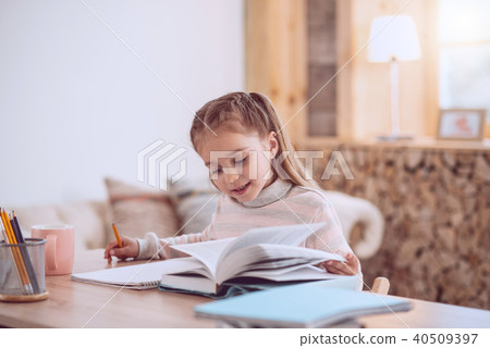 Nice smart girl reading a book Nice smart girl reading a book 40509397