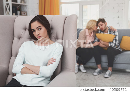 Cheerless young woman sitting in the chair 40509751