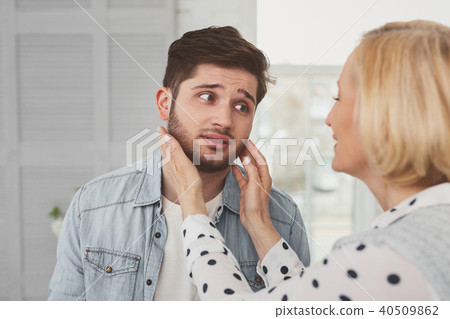 Sad bearded man looking at his mother 40509862
