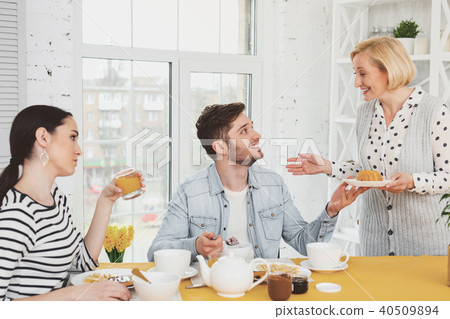Positive joyful man looking at his mother 40509894