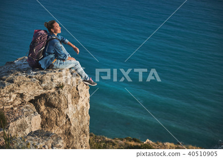 Enjoyed female camper relaxing aloft Enjoyed female camper relaxing aloft 40510905