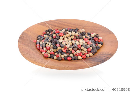 peppercorns on wooden plate peppercorns on wooden plate 40510908