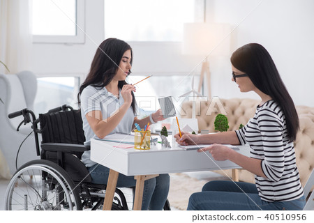 Earnest female engineers conducting measurement Earnest female engineers conducting measurement 40510956