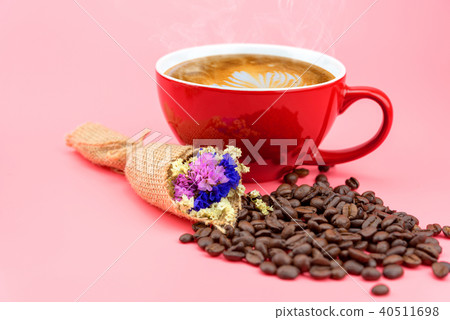 red coffee mug with flower and coffee beans 40511698