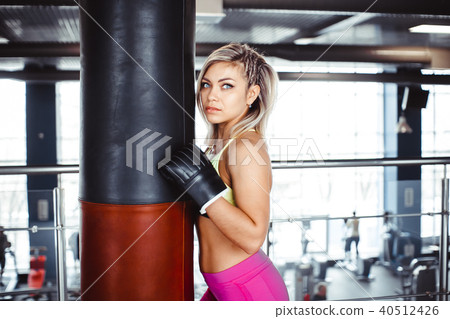 girl boxer beats the punching bag girl boxer beats the punching bag 40512426