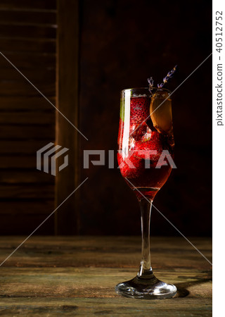 strawberry jive cocktail with ice and lavender on wooden background 40512752