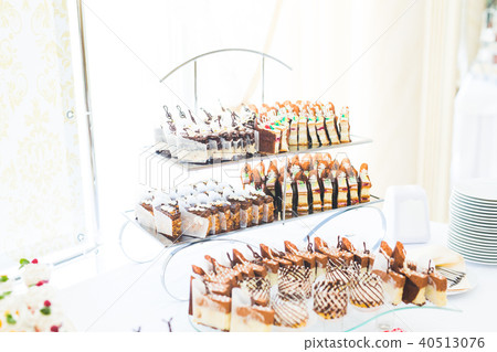 Different kinds of baked sweets on a buffet 40513076