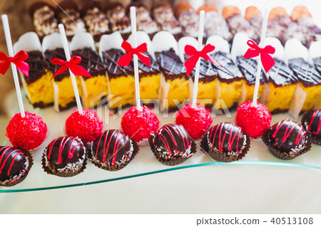 Different kinds of baked sweets on a buffet 40513108