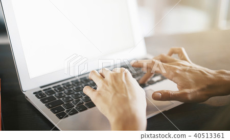 Female hands on a laptop keyboard typing Female hands on a laptop keyboard typing 40513361