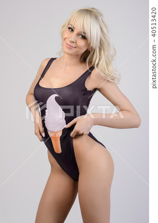 beautiful slim girl in a black swimsuit  40513420