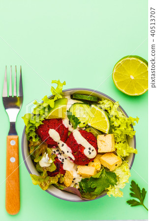Vegan buddha bowl with beetroot meatballs 40513707