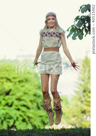tender blonde woman jumping looks into tender blonde woman jumping looks into 40515002