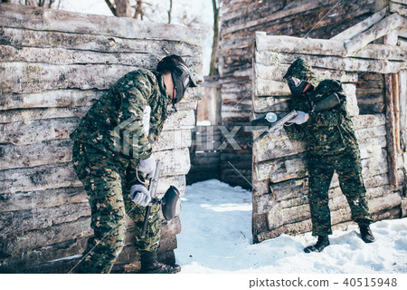 Paintball battle, paintballing in winter forest Paintball battle, paintballing in winter forest 40515948