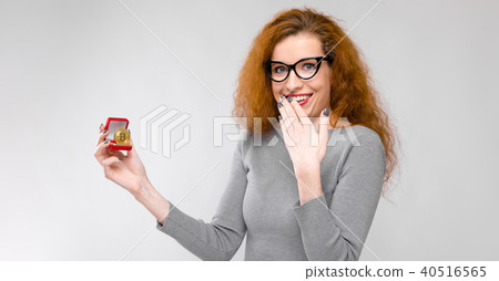 Excited woman with gift box Excited woman with gift box 40516565