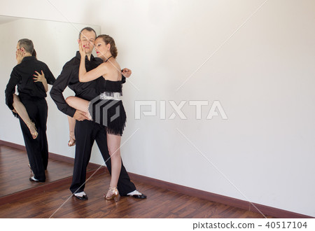Couple of dancers dancing latin dances Couple of dancers dancing latin dances 40517104