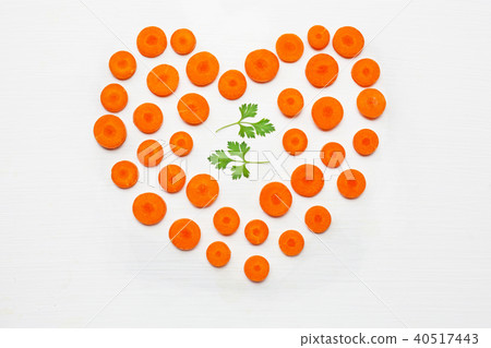 Chopped carrot slices heart shape. Chopped carrot slices heart shape. 40517443