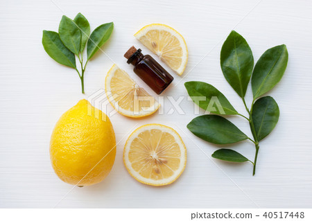 Fresh lemon with lemon essential oil . Fresh lemon with lemon essential oil . 40517448