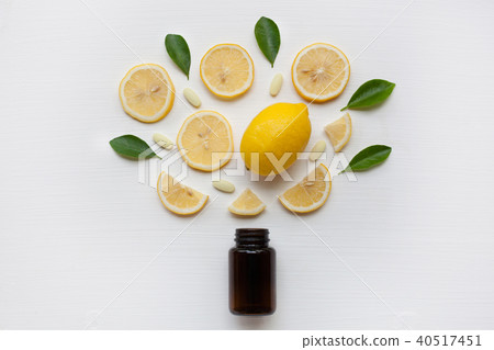 Brown Bottle with lemon, leaves and vitamin C. Brown Bottle with lemon, leaves and vitamin C. 40517451