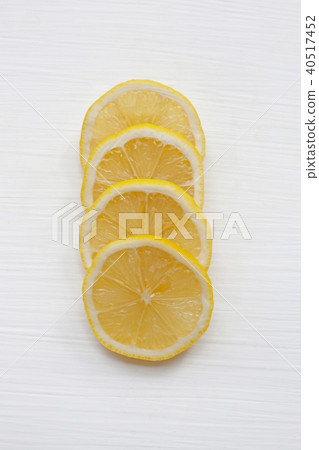 Fresh lemon slices on white. Fresh lemon slices on white. 40517452