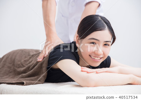 Esthetic, girl receiving massage in order 40517534
