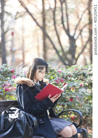 School girls reading in the park School girls reading in the park 40520451