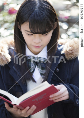 School girls reading in the park School girls reading in the park 40520511