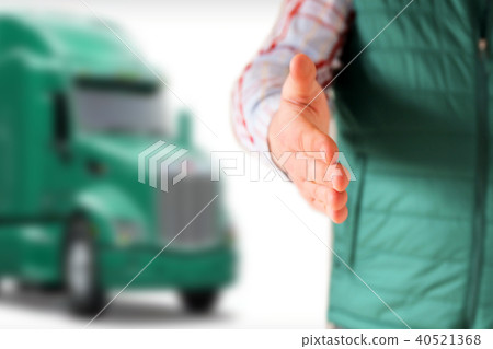 Driver with an open hand greeting.Truck behind him 40521368