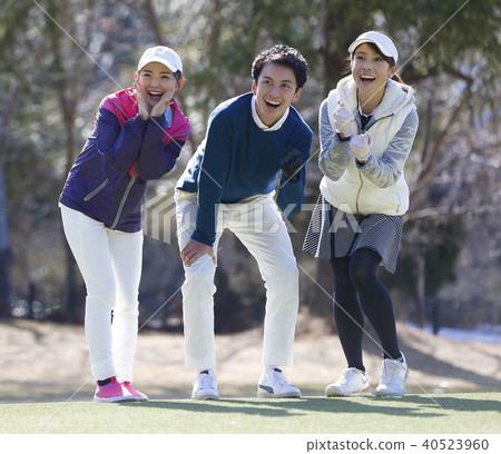 Men and women playing golf Men and women playing golf 40523960