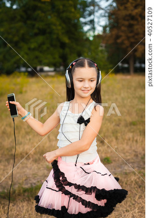 little girl dancing in the yard little girl dancing in the yard 40527109