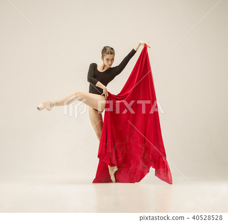 Modern ballet dancer dancing in full body on white studio background. 40528528