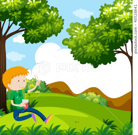 Boy eating noodles in the park 40528641