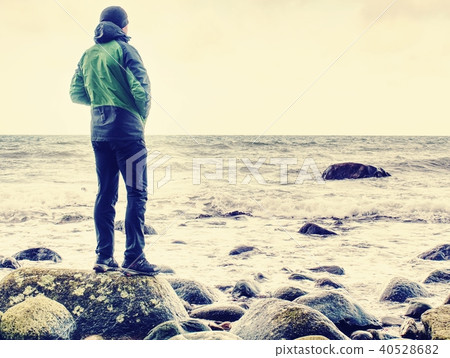 Peaceful morning sea with stones in peaceful level Peaceful morning sea with stones in peaceful level 40528682