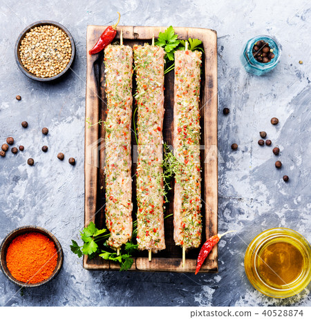 Raw minced meat skewers kebabs Raw minced meat skewers kebabs 40528874