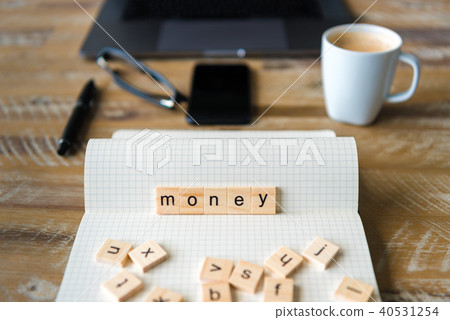 Closeup on notebook over wood table background Closeup on notebook over wood table background 40531254