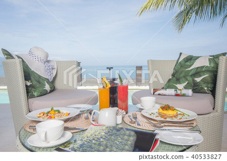 Fresh breakfast setup juice and coffee on table Fresh breakfast setup juice and coffee on table 40533827