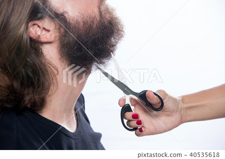 Beard styling, cut. Close up of a styling a beard Beard styling, cut. Close up of a styling a beard 40535618