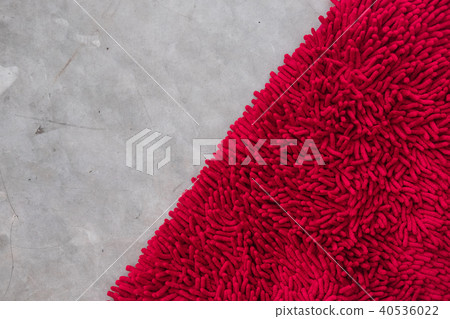 Gray concrete floor with red rug fluffy carpet Gray concrete floor with red rug fluffy carpet 40536022