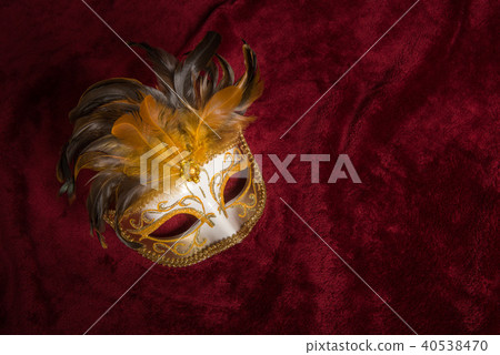 Venetian carnival mask with feathers on velvet 40538470