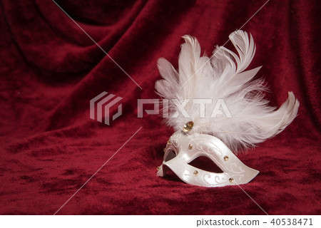 White venetian carnival mask on red velvet White venetian carnival mask on red velvet 40538471
