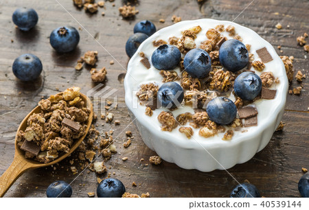 Yogurt with Fresh Blueberries on Woden Table Yogurt with Fresh Blueberries on Woden Table 40539144