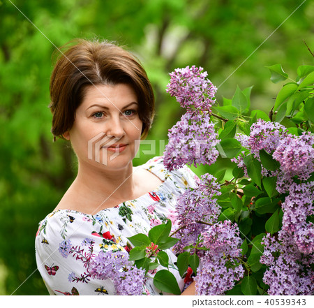 adults woman in alilac garden adults woman in alilac garden 40539343