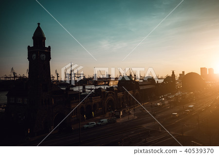 Silhouette of famous Hamburger Landungsbruecken with commercial harbor and Elbe river in late 40539370