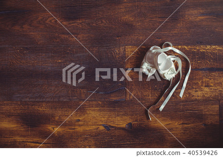 Close-up of cute baby shoes on a wooden  40539426