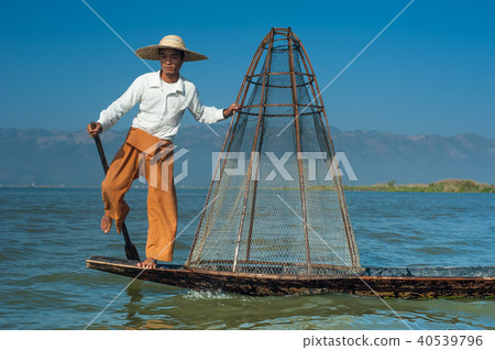 Burmese fisherman on boat catching fish. Myanmar Burmese fisherman on boat catching fish. Myanmar 40539796